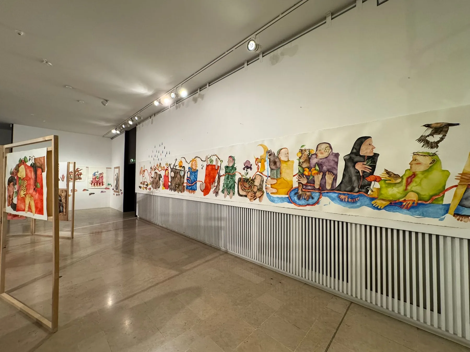 The ten-metre painting Those Who Walk the Land running the length of the hall at the Institut des Cultures d'Islam